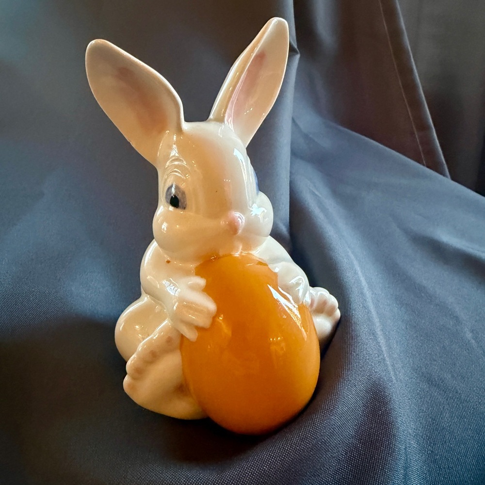 Playful Ceramic Bunny with Orange Egg